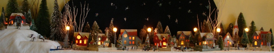 Antique Christmas cardboard house putz (village) on small fireplace mantel  (50K)