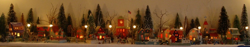 Antique Christmas cardboard house putz (village) on large fireplace mantel  (50K)